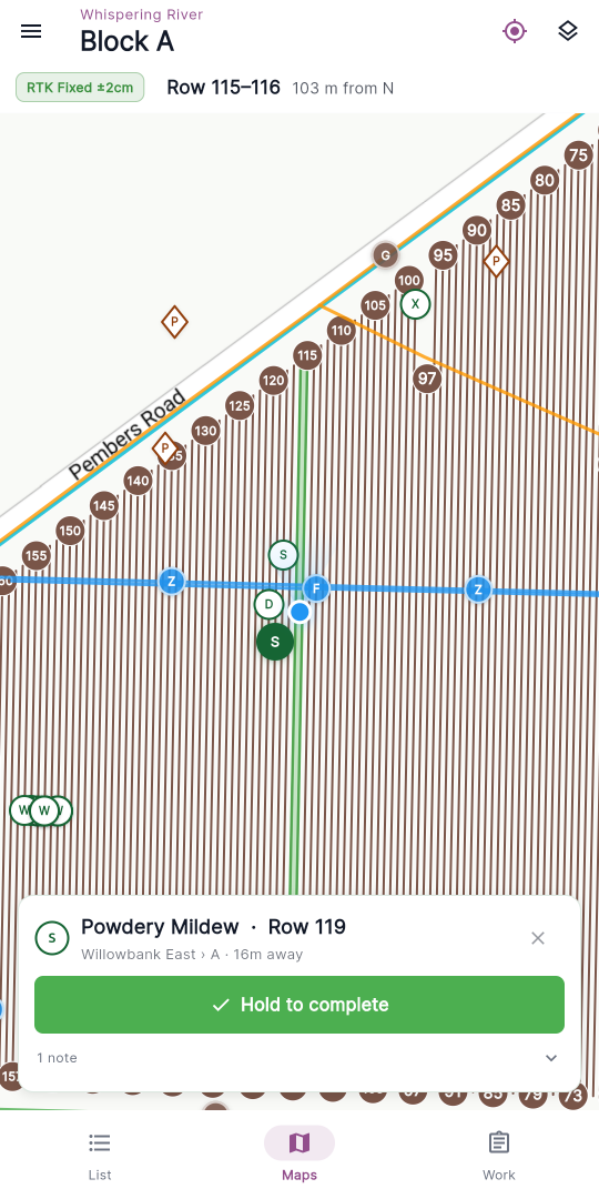 The folded trouble-spot detail card — type and Row N, the vineyard › block · distance line, the green Hold to complete button and the fold summary line.